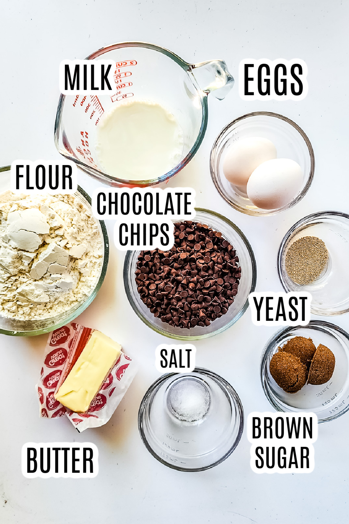 The ingredients needed to make the Chocolate Brioche loaf include milk, eggs, flour, chocolate chips, yeast, brown sugar, salt and butter.