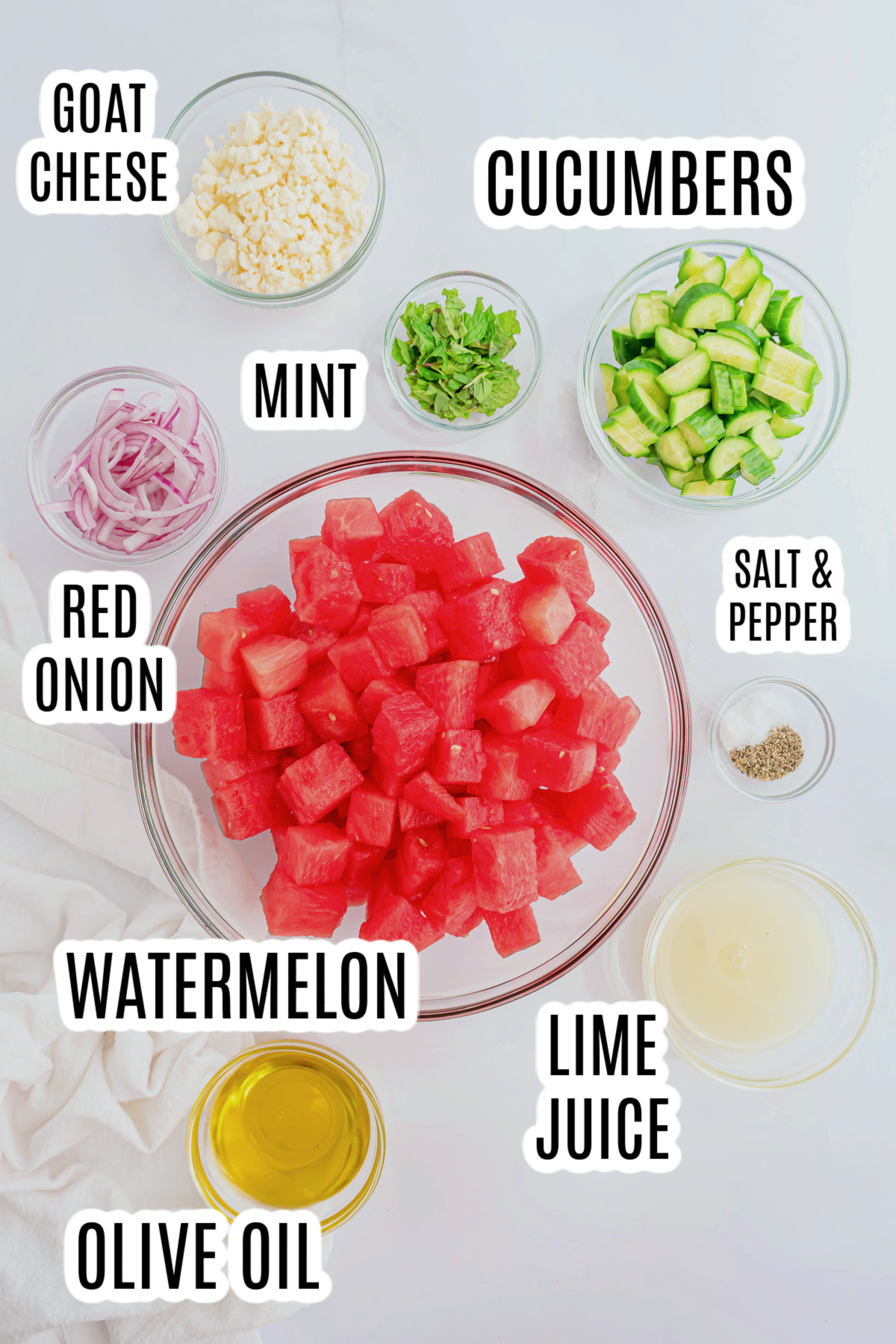 The ingredients needed to make the Watermelon Salad with Goat Cheese include cucumbers, fresh mint, sliced red onions, goat cheese, watermelon, salt, pepper, lime juice and olive oil.