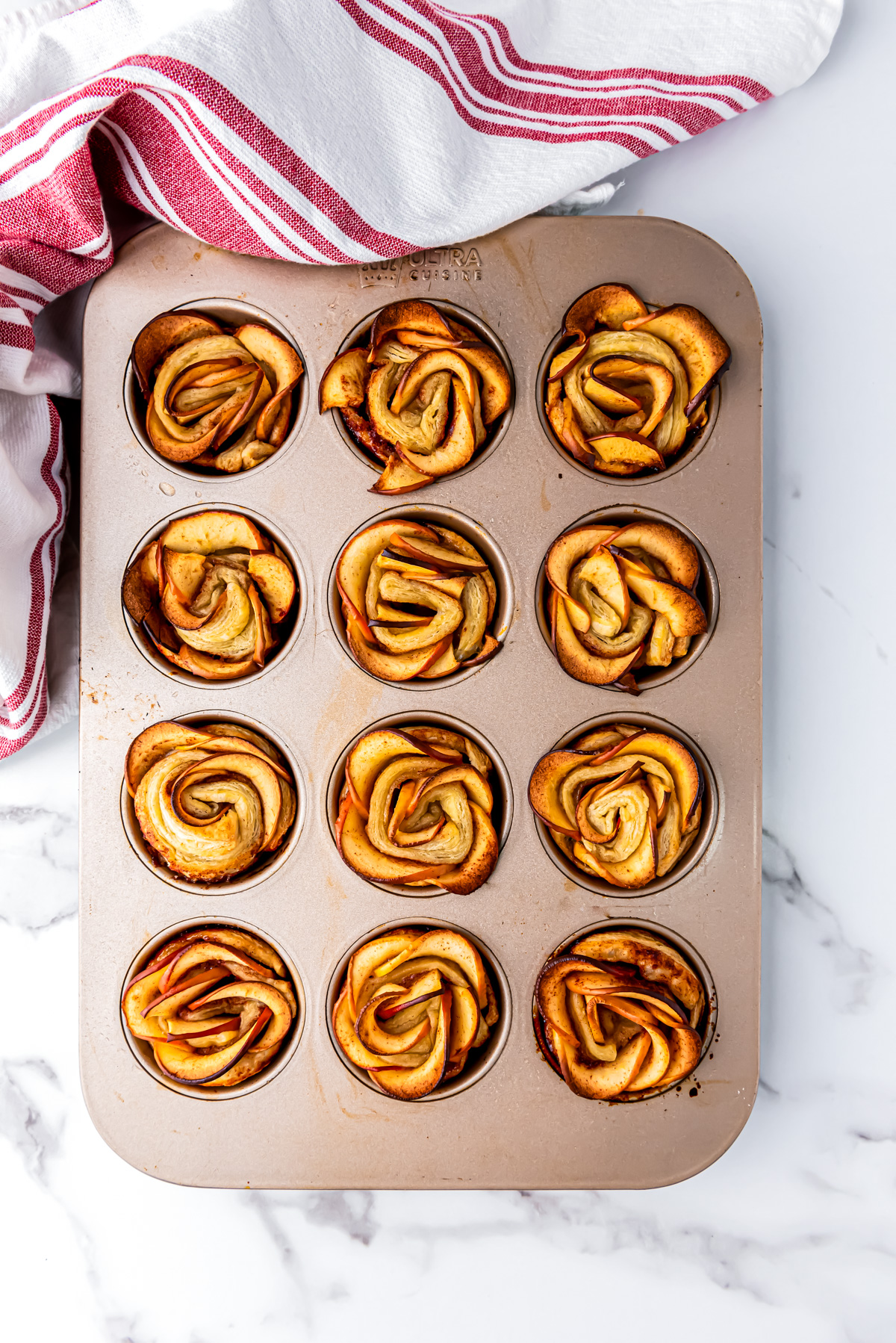 Apple Roses that have been baked in a muffin tin.