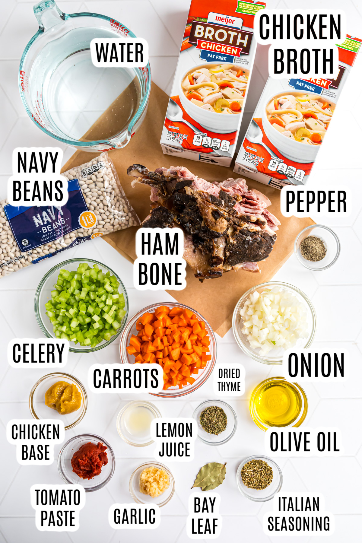 The ingredients needed to make the Navy Bean Soup Recipe include:
dried navy beans, water, chicken broth, leftover ham bone, pepper, onion, carrots, cellery, dried thyme, onion, olive oil, lemon juice, italian seasoning, chicken base, tomato paste, bay leaf, and minced garlic.