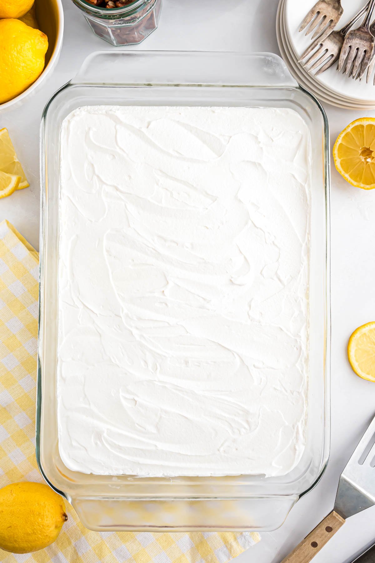 A glass baking dish with the finished Lemon Lush dessert in it.