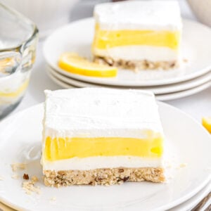 A piece of Lemon Lush dessert on a small serving plate.