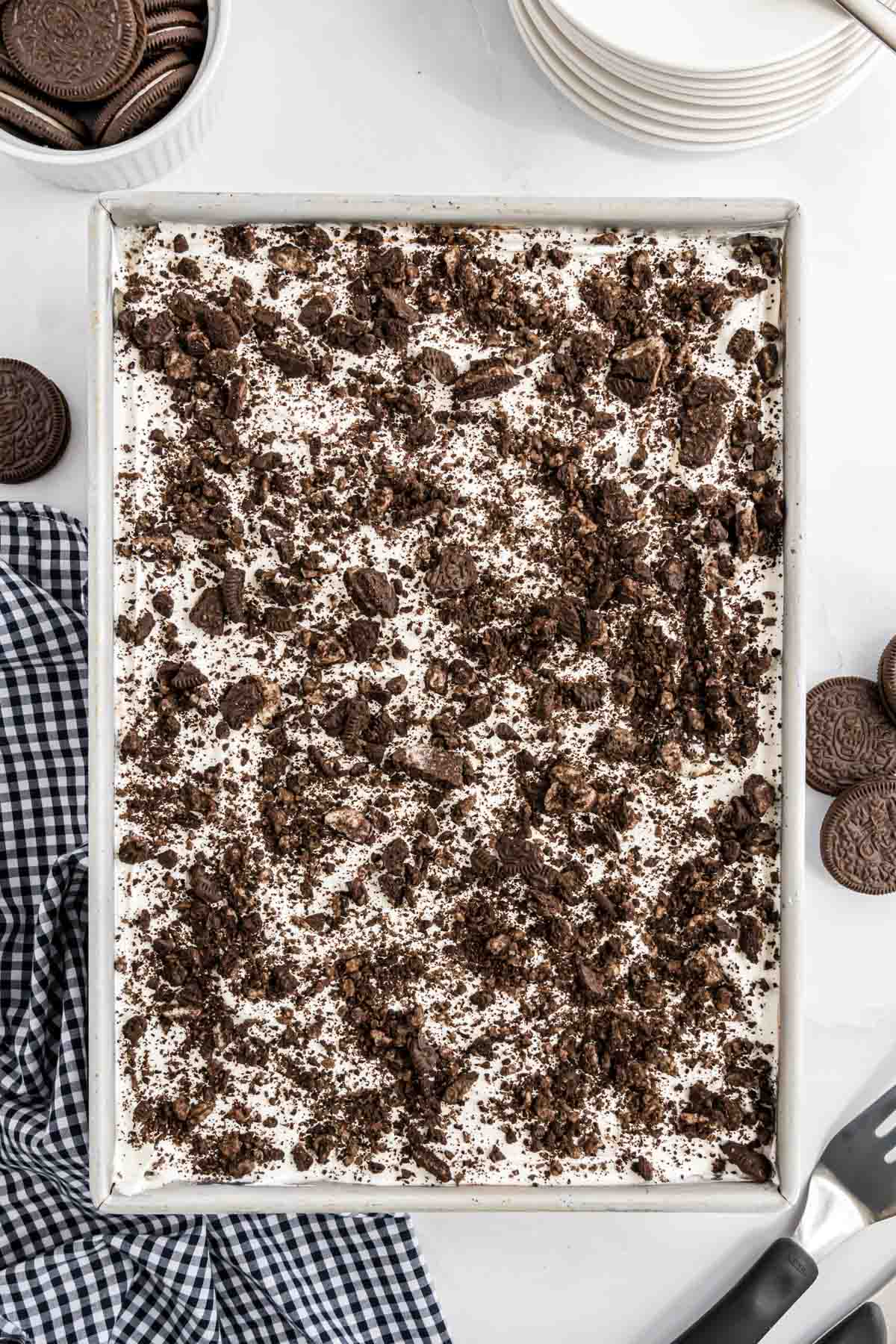 The ice cream dessert with crushed Oreos sprinkled on top of it.