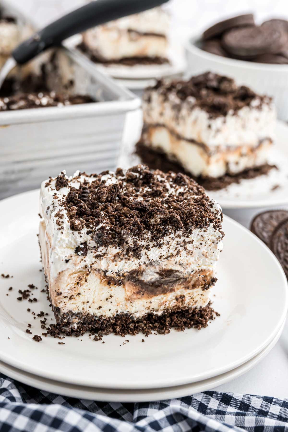 A piece of Oreo Ice Cream Cake on a serving plate.