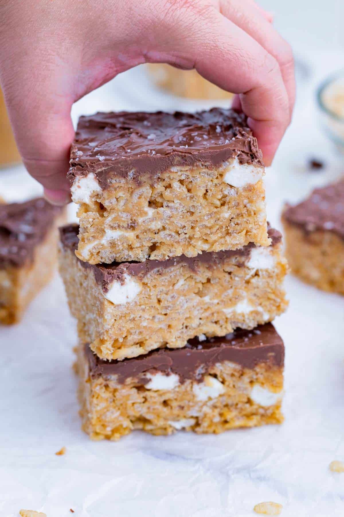 Peanut Butter Rice Krispie Treats topped with chocolate.