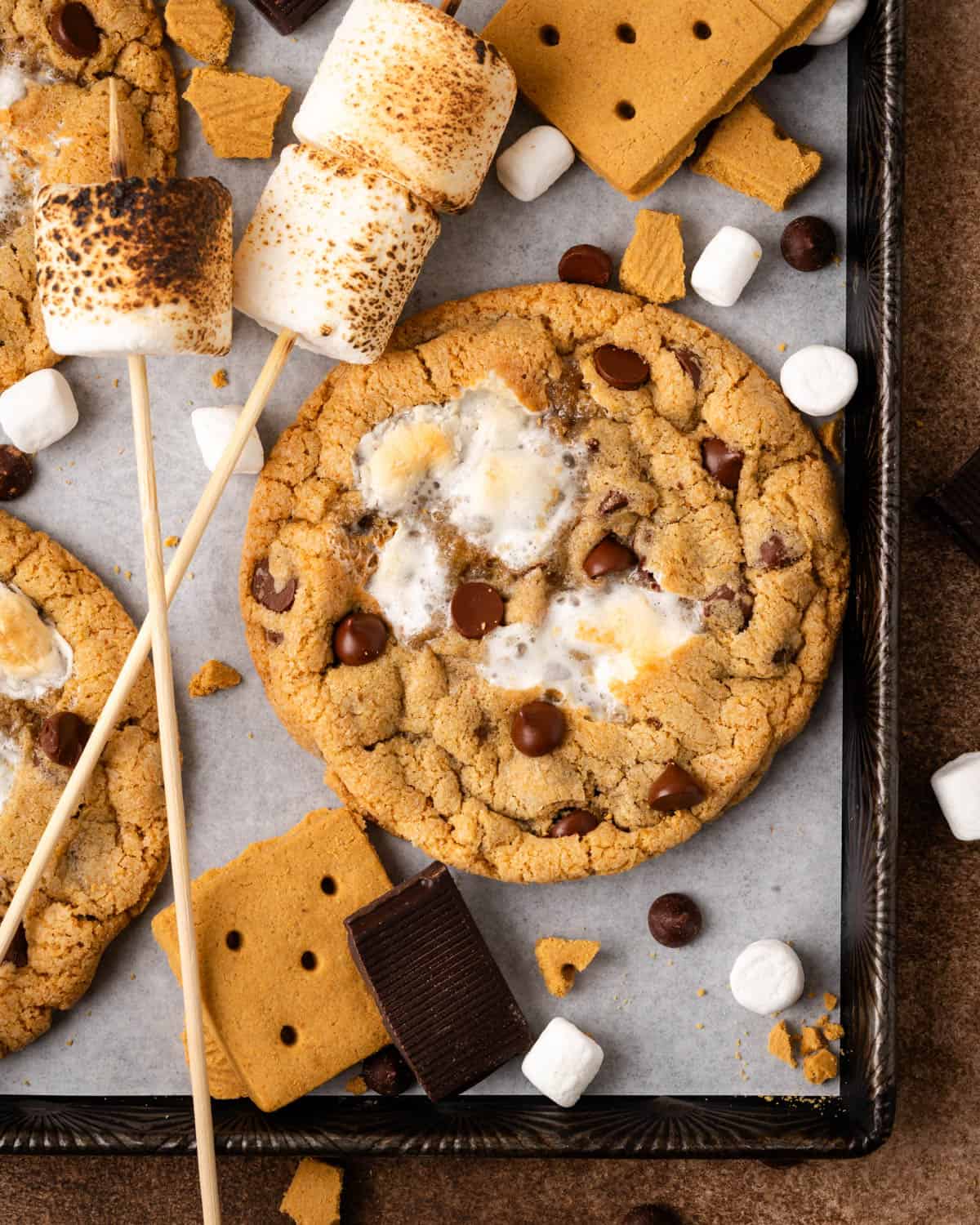 A large s'mores cookie on a baking sheet.