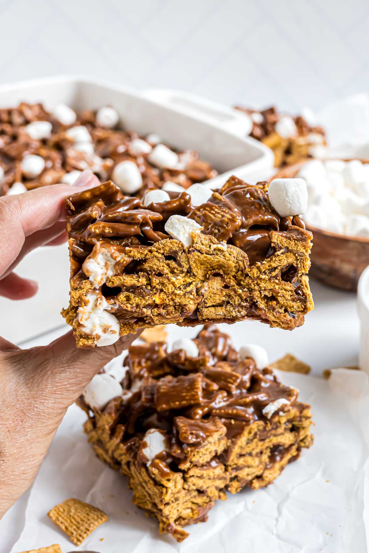 A Golden Grahams Bar cut to showcase the texture of the marshmallow and chocolate cereal bar.