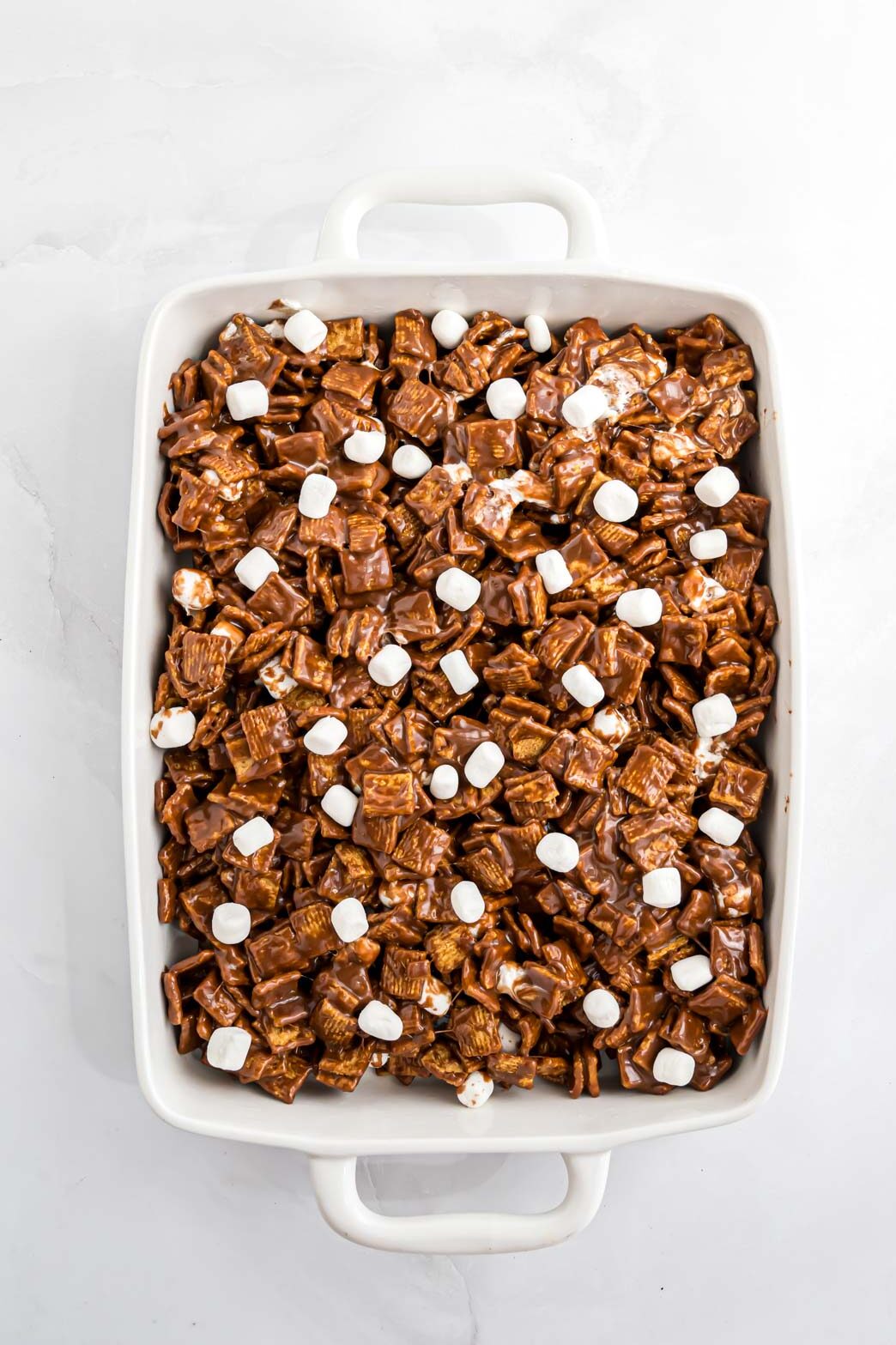 The s'more mixture pressed into a pan.