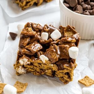 A Golden Graham cereal s'mores bar on a piece of parchment paper.