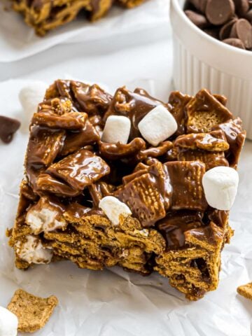 A Golden Graham cereal s'mores bar on a piece of parchment paper.