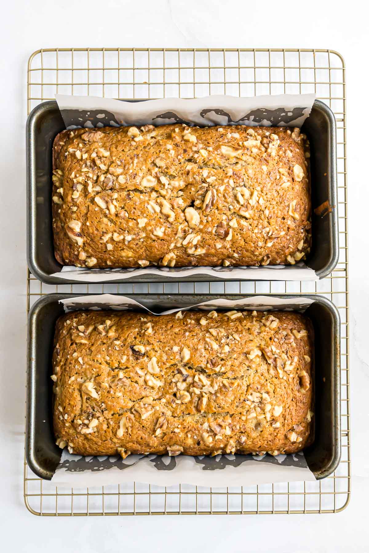 Banana Nut Bread in two loaf pans after baking.
