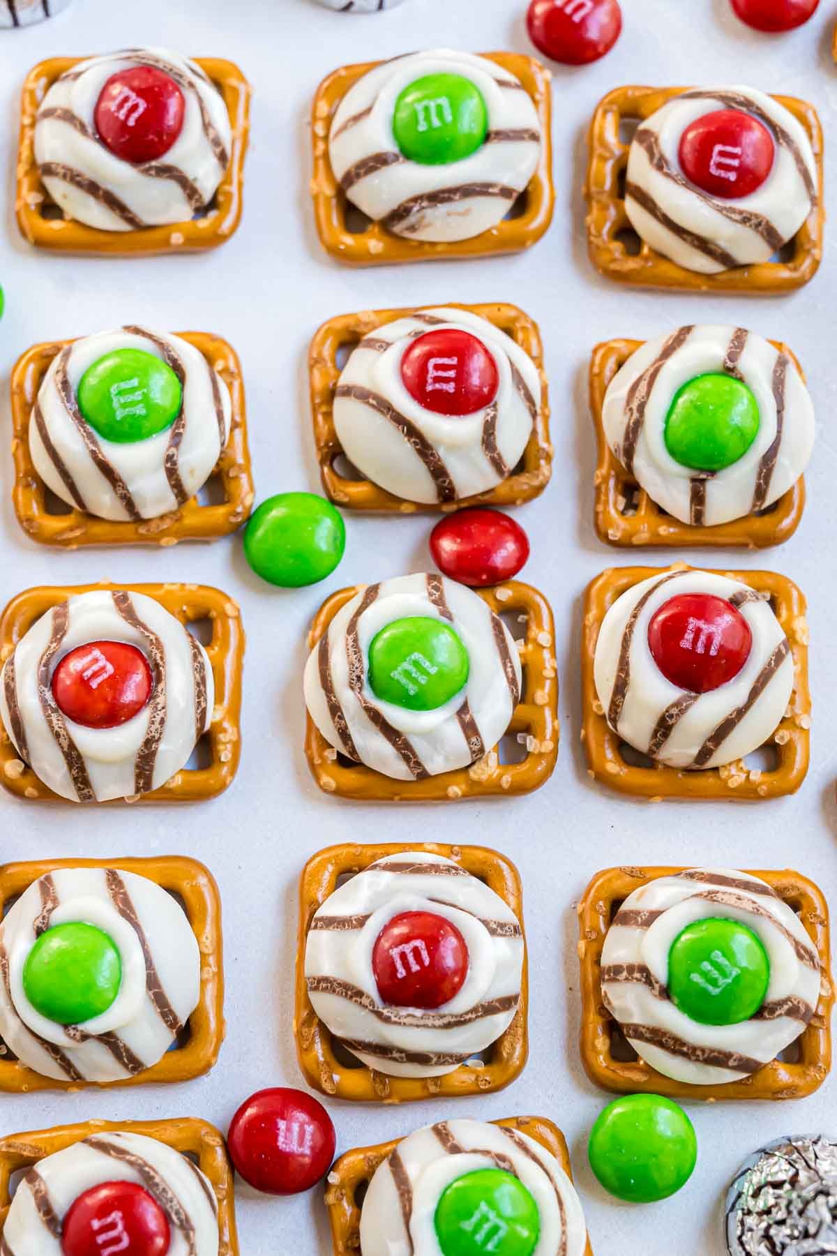 Pretzel Hugs featuring red and green M&M candies for Christmas.
