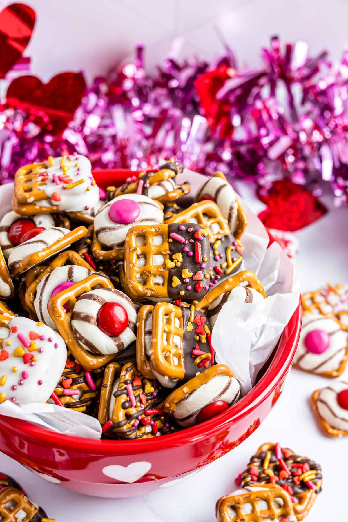 Pretzel Hugs featuring red and pink M&M candies for Valentine's Day.