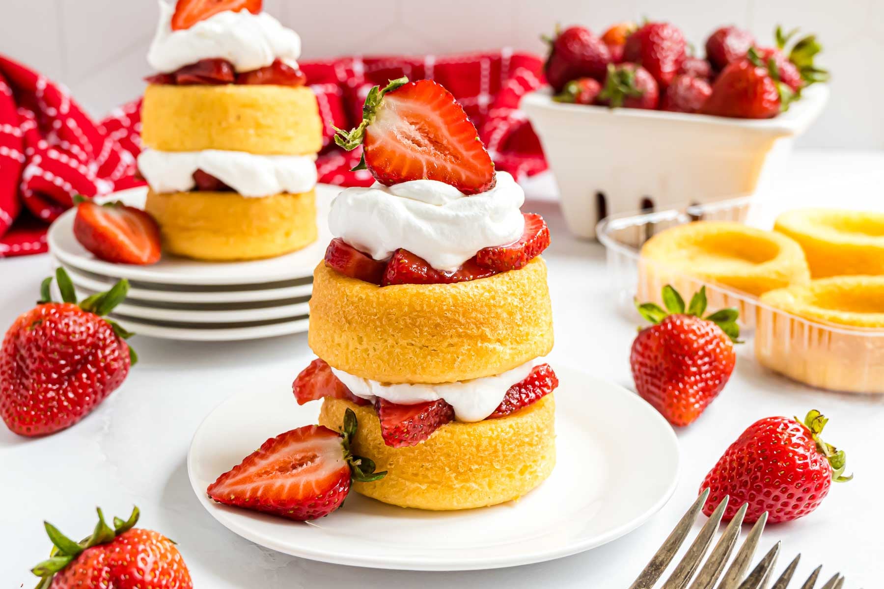 A two-layer strawberry shortcake made with store-bought dessert shells and fresh strawberries, topped with Cool Whip.