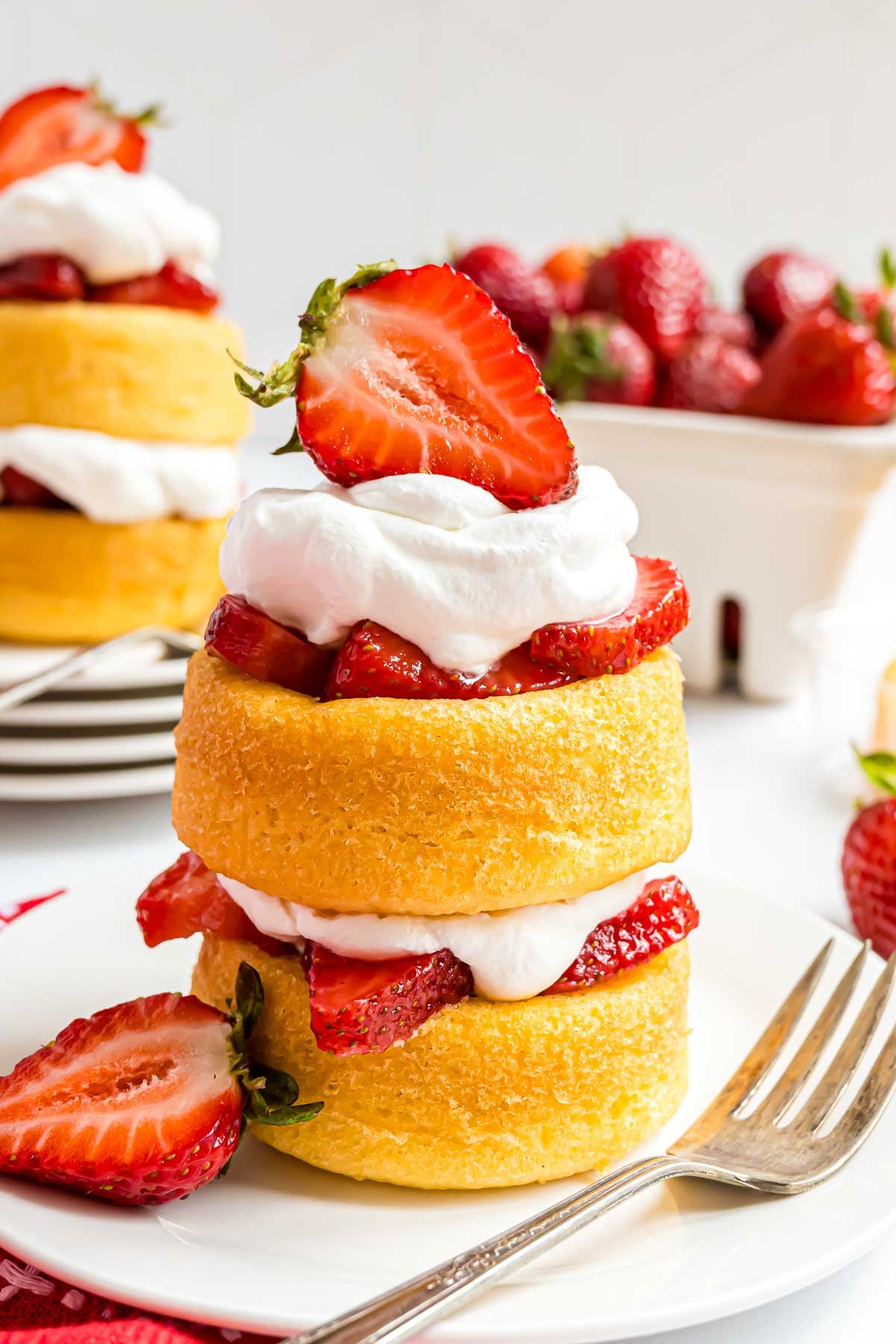 A two-layer strawberry shortcake made with store-bought dessert shells and fresh strawberries, topped with Cool Whip.