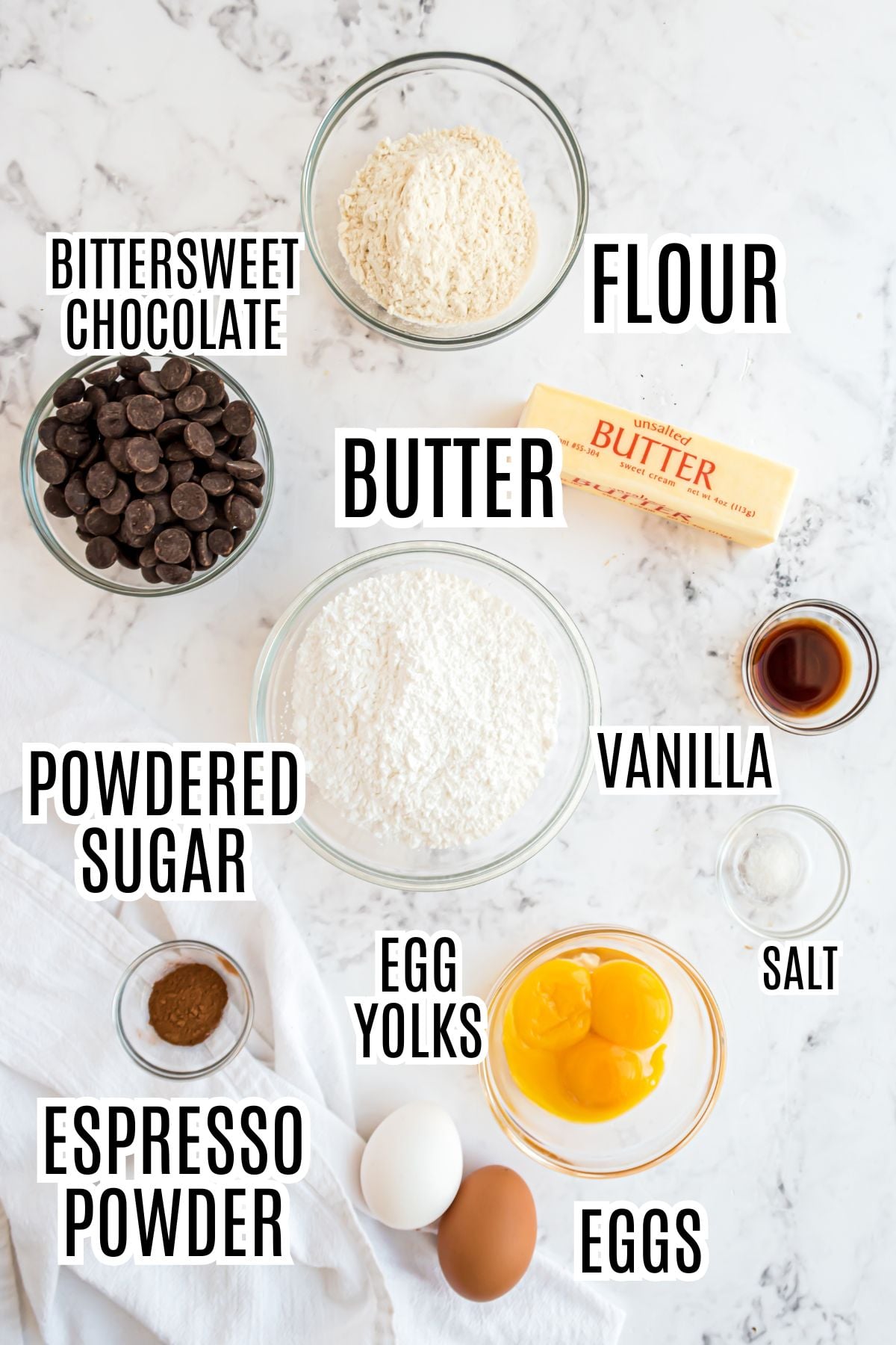 The ingredients needed to make the Lava Cakes include butter, powdered sugar, flour, vanilla, salt, espresso powder, eggs, egg yolks, and bittersweet chocolate.