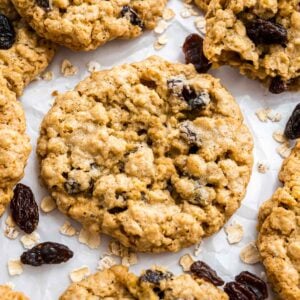 An oatmeal raisin cookie on a baking sheet.