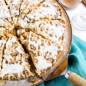 A Cinnamon Streusel Coffee Cake, sliced on a round serving plate.