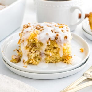 A piece of morning glory cake on a small serving plate.