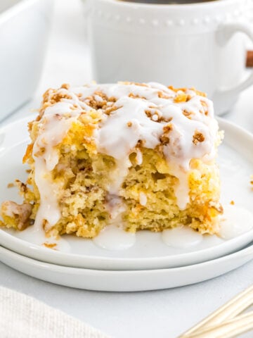 A piece of morning glory cake on a small serving plate.