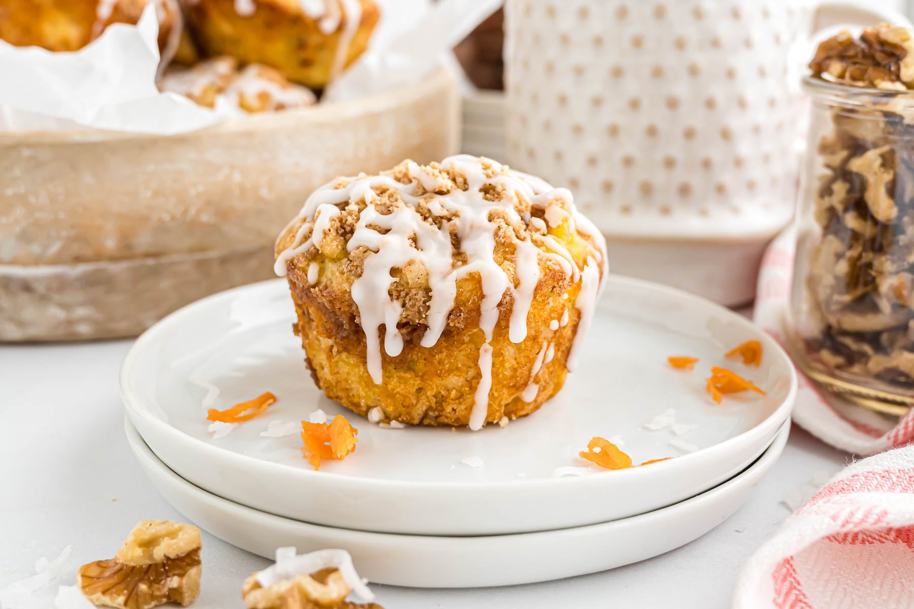 A morning glory muffin on a small serving plate.